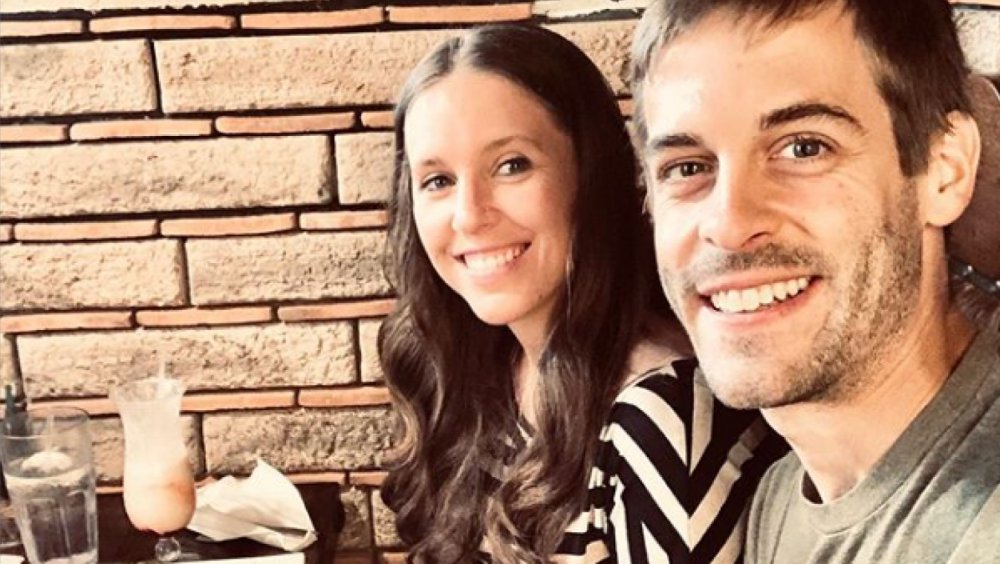 Jill Duggar Dillard and Derick Dillard with a pina colada