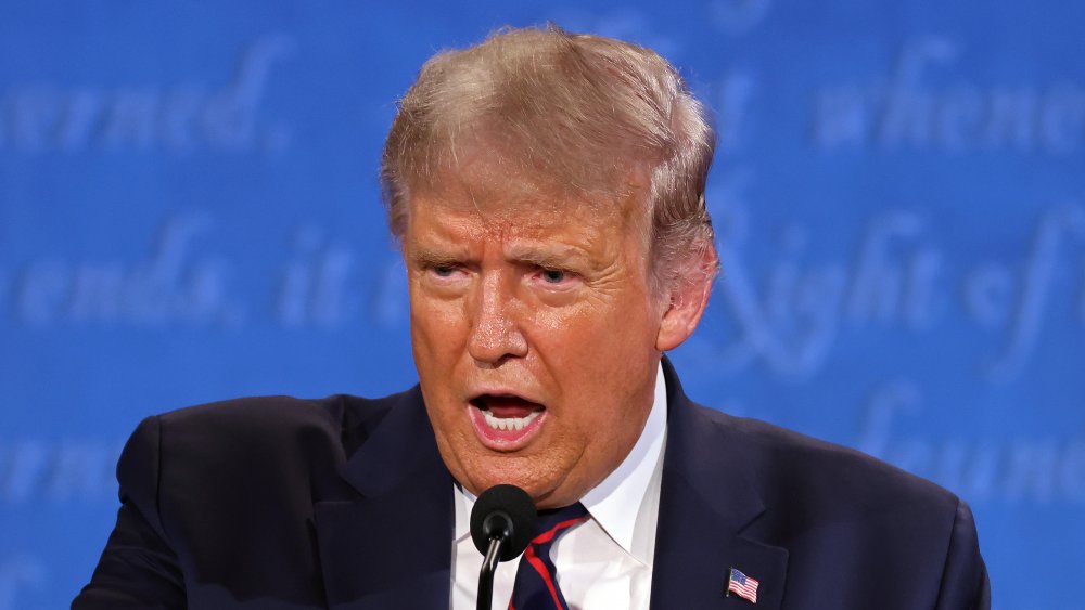 Donald Trump speaking into microphone