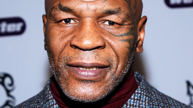 Mike Tyson does not smile with a tattoo on his face