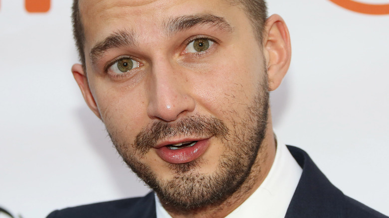 Shia LaBeouf shaved head short beard