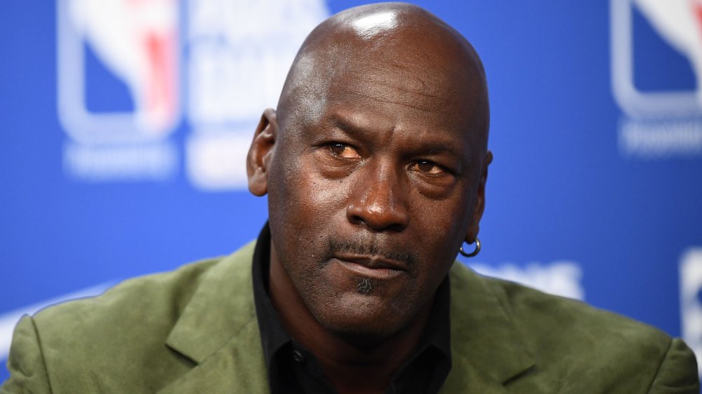 Michael Jordan of the Chicago Bulls listens to a question addressed to him about his future 11 June during a press conference after practice for Game Five of the NBA Finals
