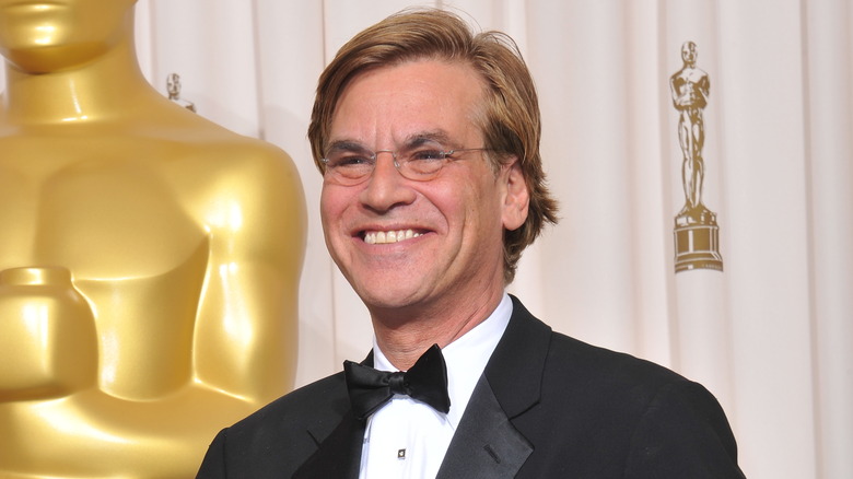 Aaron Sorkin smiles on awards red carpet