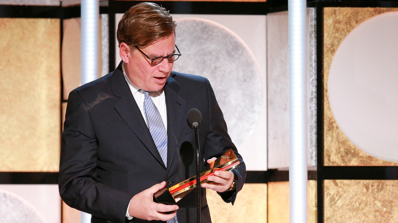 Aaron Sorkin speaking, holding award