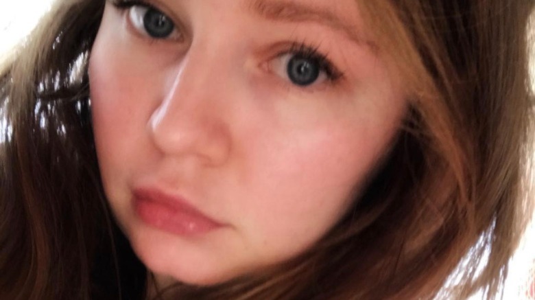 Anna Delvey, taking a selfie