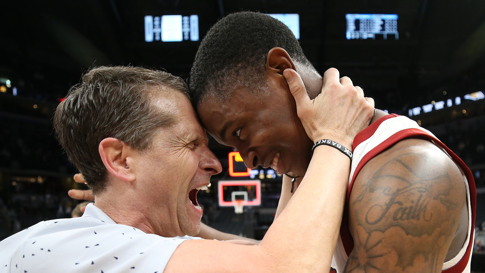 Eric Musselman embracing his basketball player