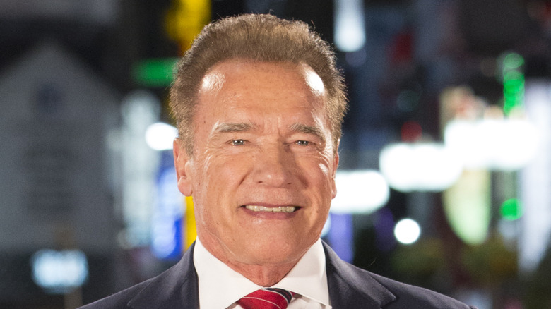 Arnold Schwarzenegger smiling relaxed lights