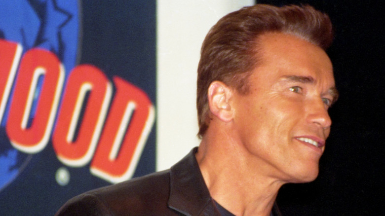 Arnold Schwarzenegger outside Planet Hollywood