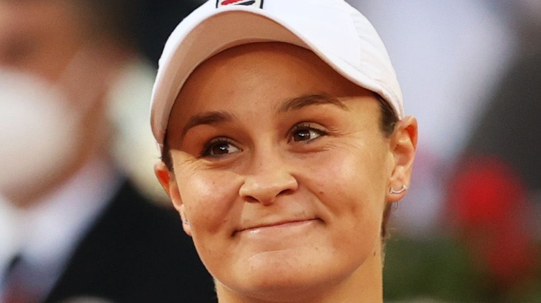 Ashleigh Barty smirking and looking to the side