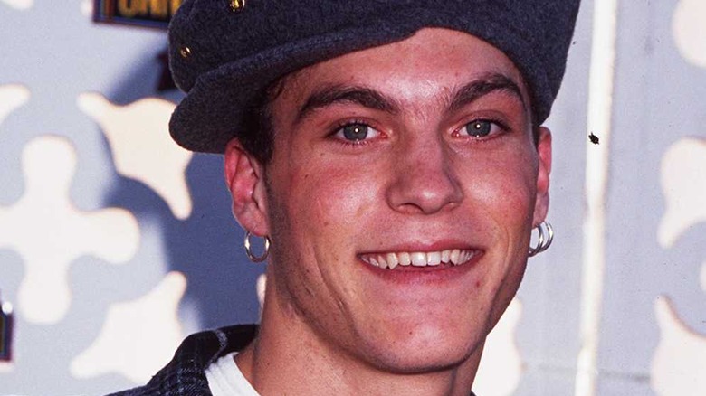 A young Brian Austin Green wearing a hat