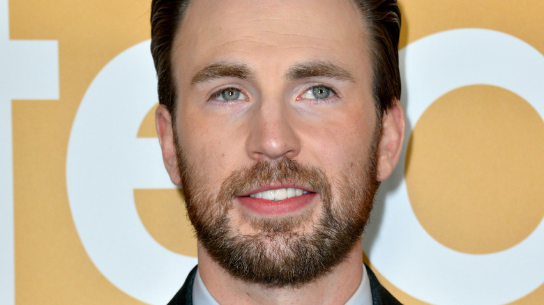 Chris Evans smiles on the red carpet