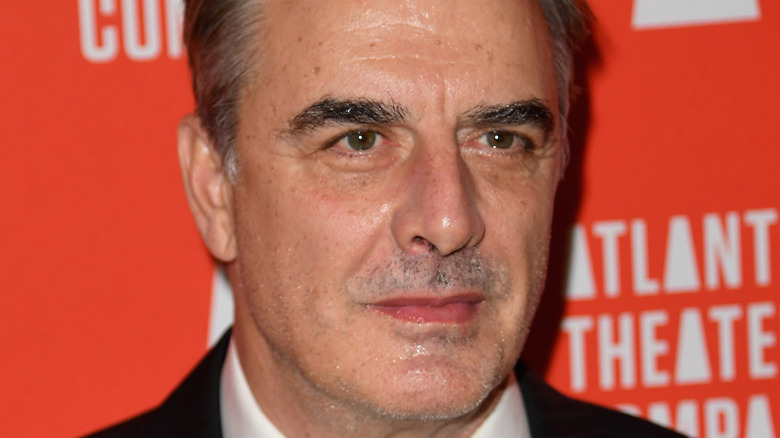 Chris Noth looks on