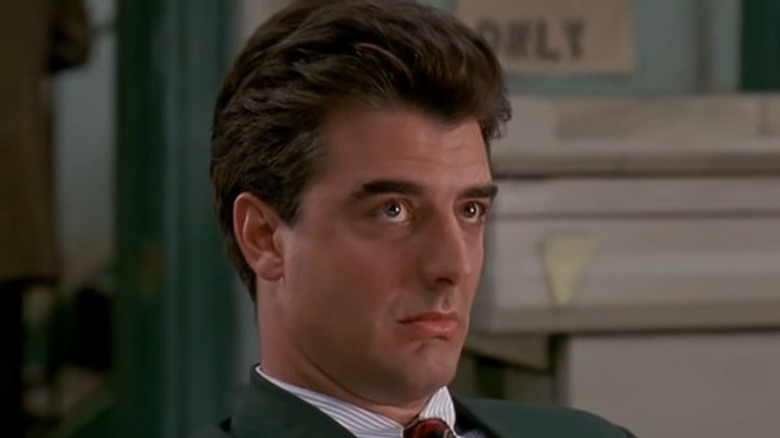 Chris Noth wearing green blazer, looking up on Law and Order
