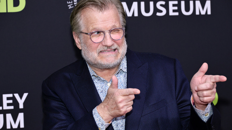 Drew Carey making face and hand gesture