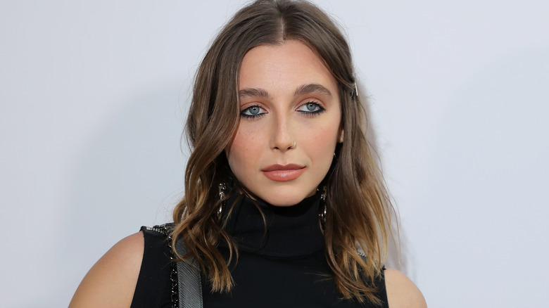 Emma Chamberlain in black, posing