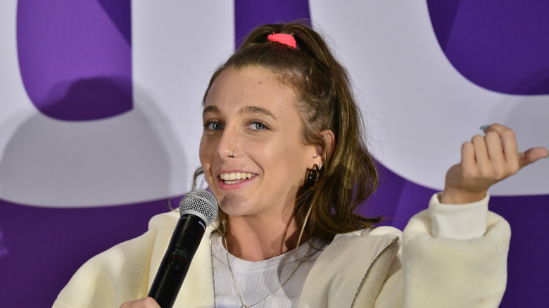 Emma Chamberlain holding microphone 