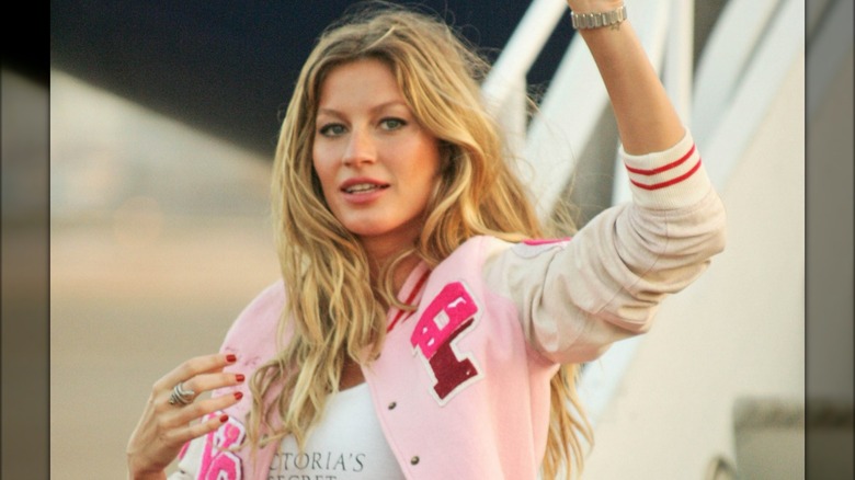 Gisele Bundchen in pink varsity jacket