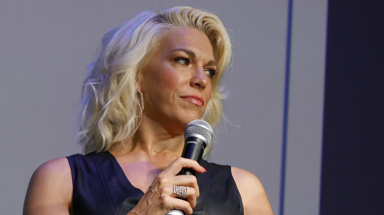 Hannah Waddingham holding microphone