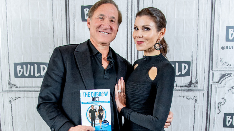 Terry Dubrow and Heather Dubrow posing
