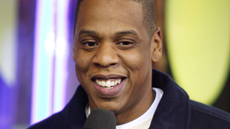 Jay-Z smiling in an interview