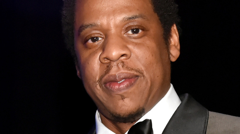 Jay-Z posing with an award