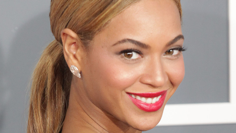 Beyonce long hair red lip smiling