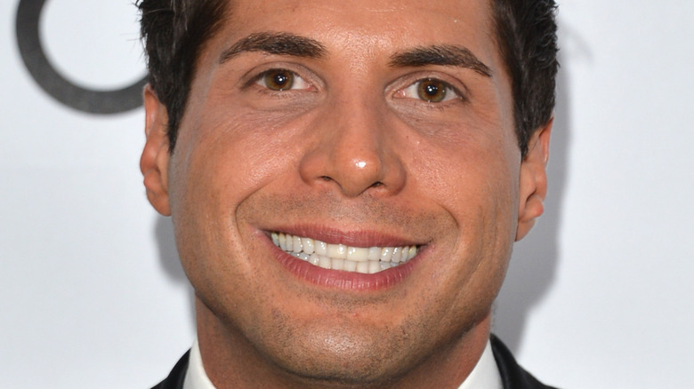 Joe Francis smiling eerily