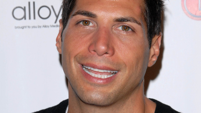 Joe Francis cocks his head to the left