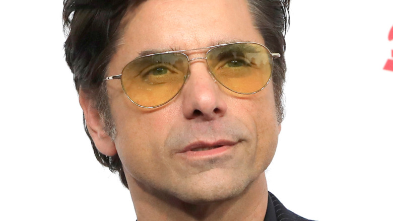 John Stamos wearing sunglasses