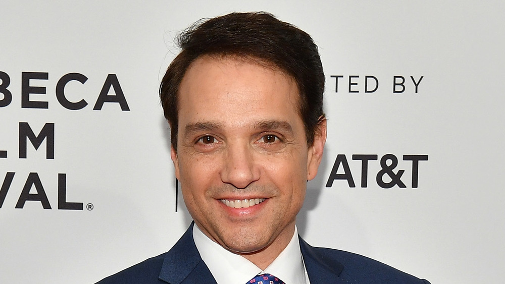 Ralph Macchio smiling on a red carpet