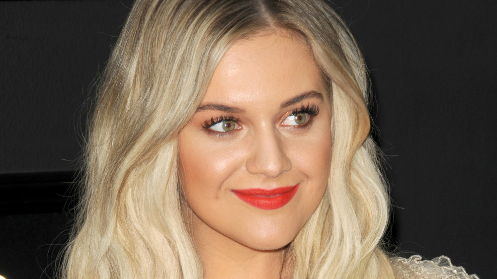 Kelsea Ballerini smiling at a red carpet event