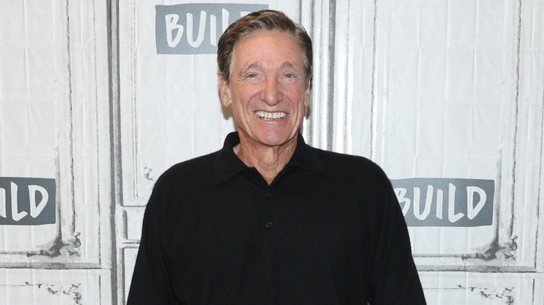Maury Povich wearing a black shirt
