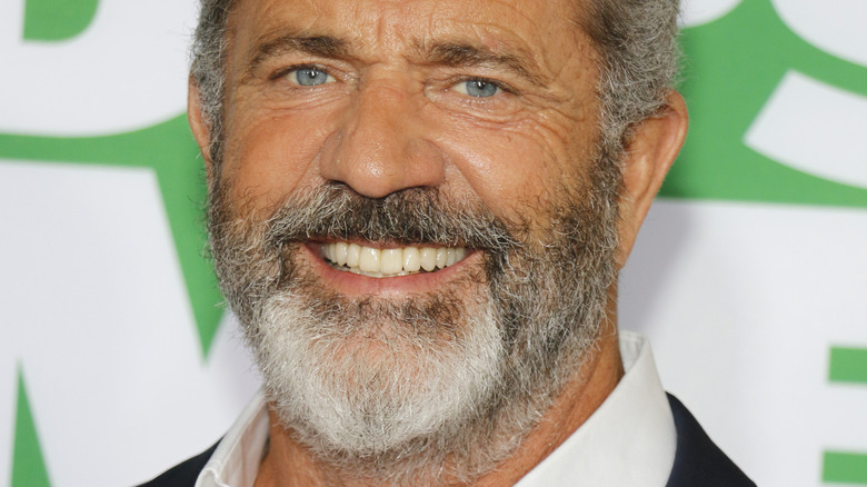 Mel Gibson smiling at red carpet event