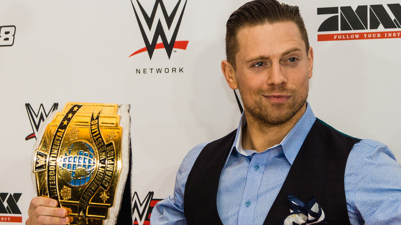 Mike The Miz Mizanin holding a wrestling belt