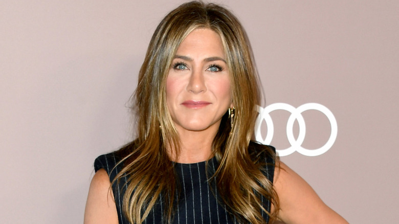 Jennifer Aniston posing with one hand on her hip