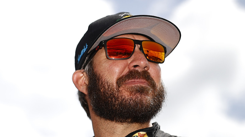 Martin Truex Jr looks into the sky on the race track