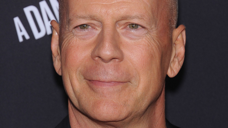 Bruce Willis slightly smiling