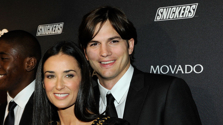 Demi Moore and Ashton Kutcher posing