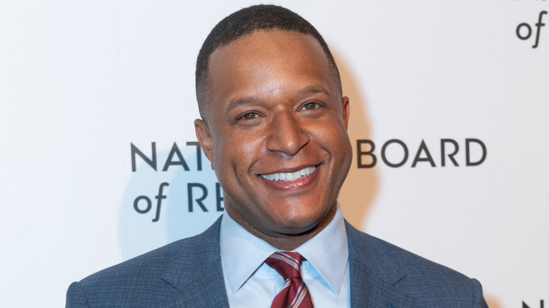 Craig Melvin poses on the red carpet