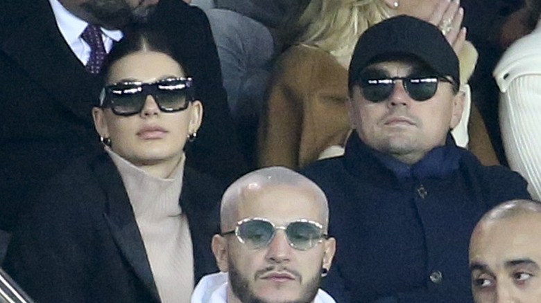 Camila Morrone and Leonardo DiCaprio watching a game