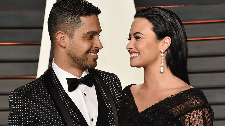 Wilmer Valderrama and Demi Lovato smiling