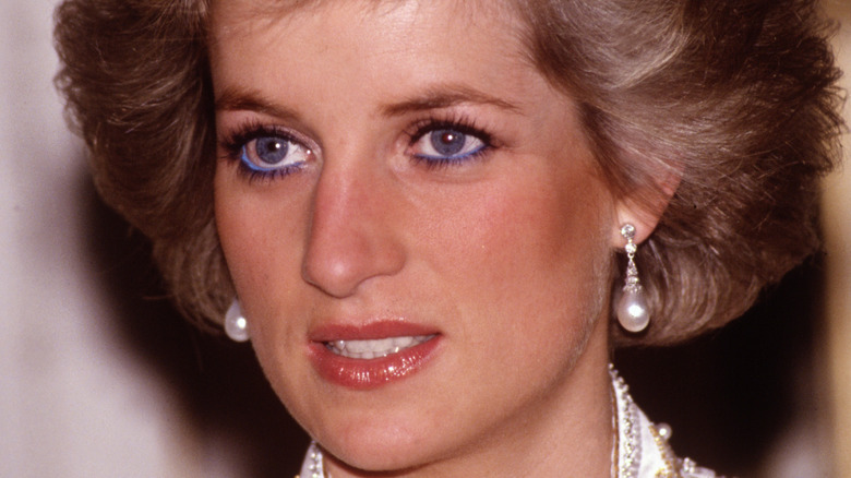 Princess Diana wearing pearl earrings.