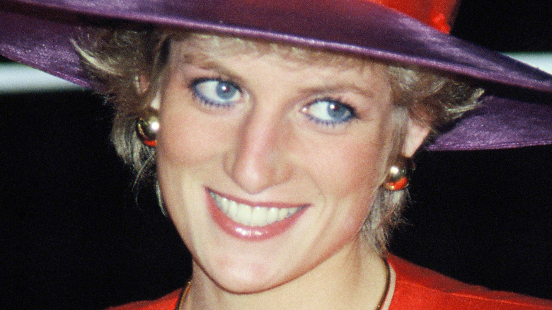 Princess Diana in a purple hat