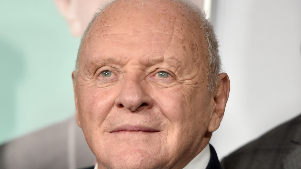 Anthony Hopkins, not smiling, red carpet, older, in a suit