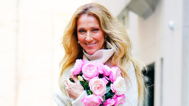 Celine Dion holding roses