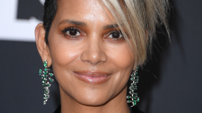 Halle Berry wearing green earrings