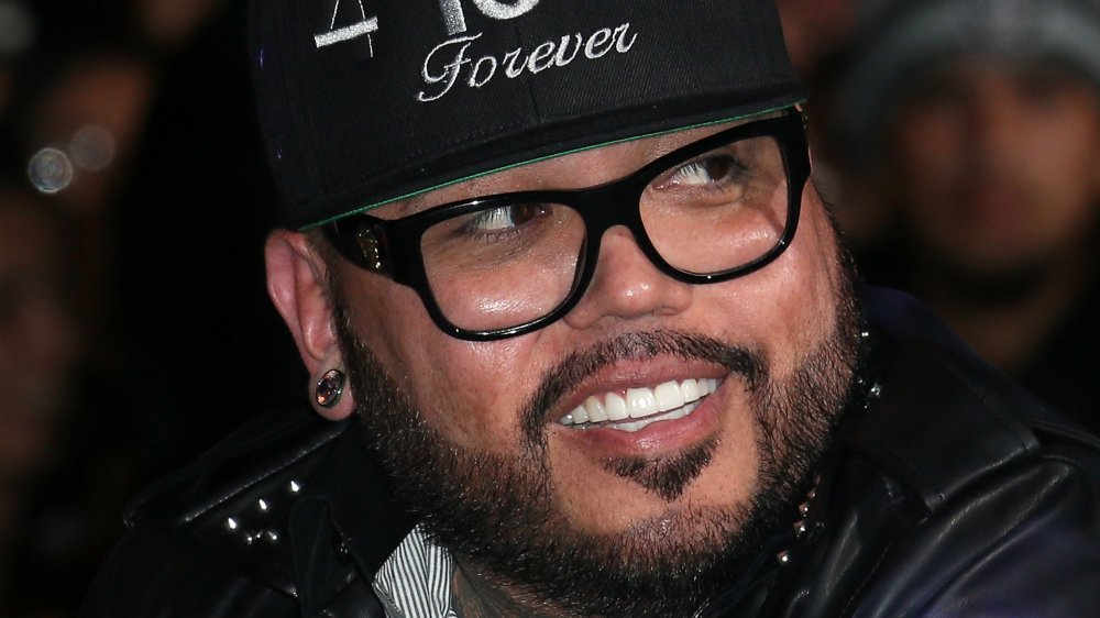 A.B. Quintanilla close up, smiling