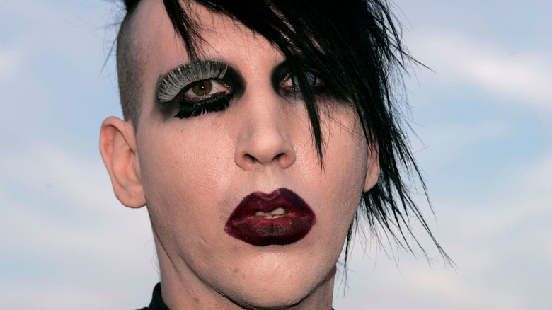 Marilyn Manson red lipstick black hair eyeliner