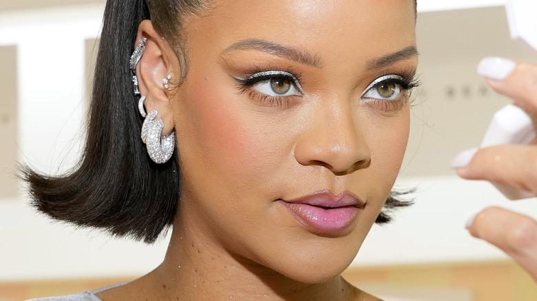 Rihanna wearing multiple earrings