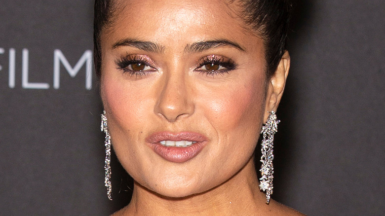 Salma Hayek wearing silver chandelier earrings