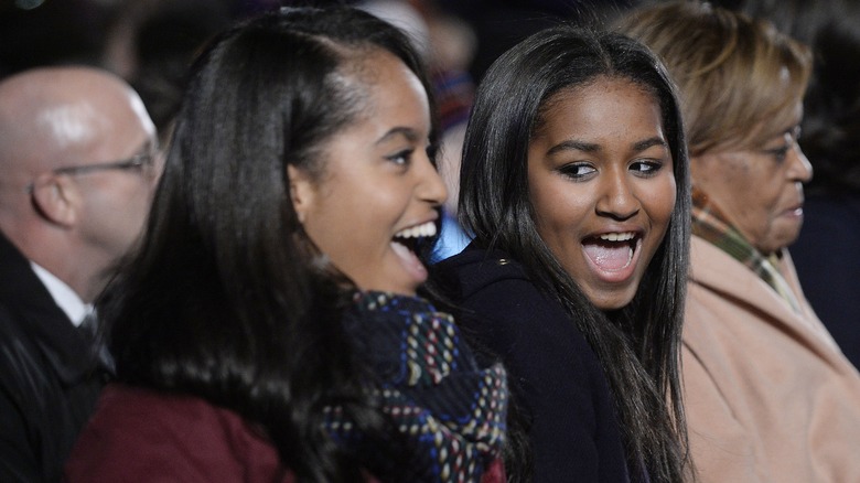 Malia and Sasha Obama with excited expressions